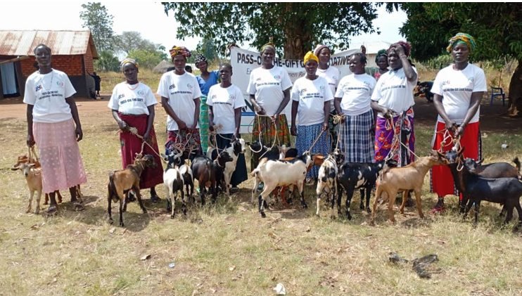 Women beneficiaries with goats received through the Pass-on-the-Gift initiative.