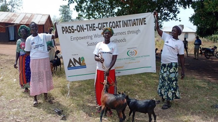 Women beneficiaries meeting beneath a tree in Pajok Payam.
